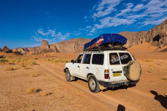 4WD near Moul Naga dunes, Tadrart region, Tassili n' Ajjer National Park, Sahara, North Africa