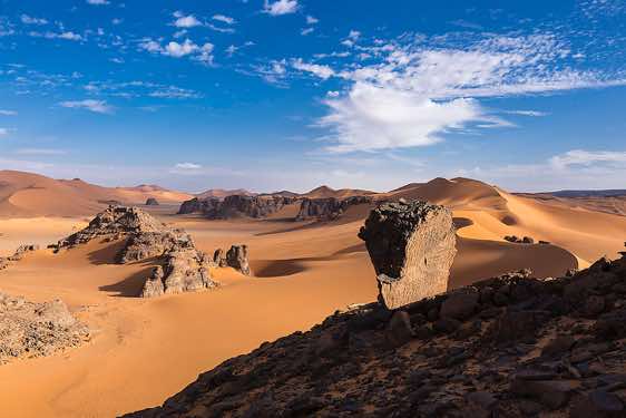 Sand dunes and rock towers at Ouan Zaouatan, Tadrart region, Tassili n ́Ajjer National Park, Sahara, North Africa