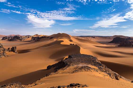 Sand dunes and rocks at Ouan Zaouatan, Tadrart region, Tassili n ́Ajjer National Park, Sahara, North Africa