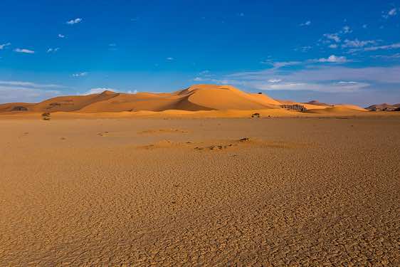 Sand dunes and claypan, playa, Ouan Zaouatan, Tadrart region, Tassili n ́Ajjer National Park, Sahara, North Africa