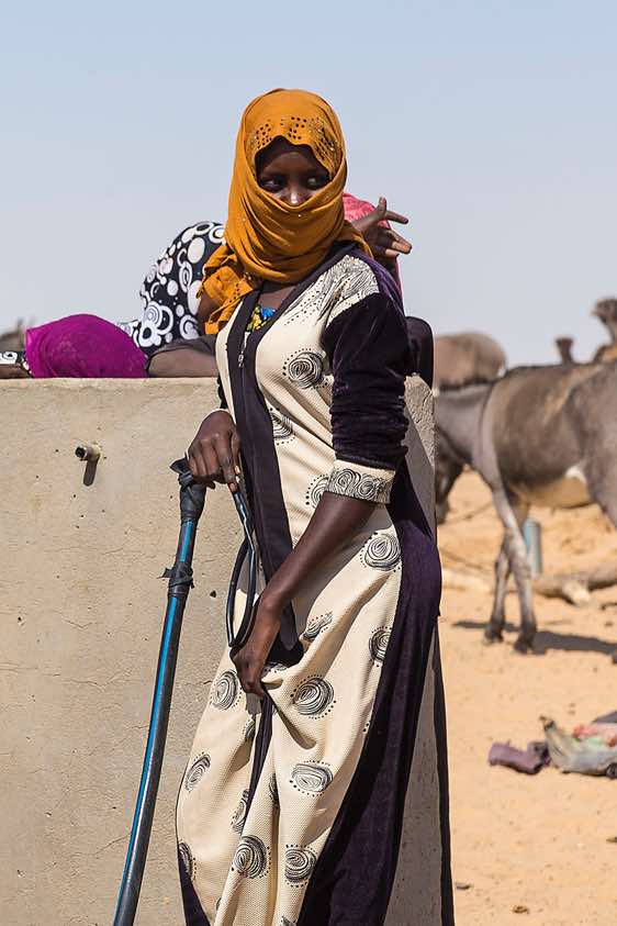 Nomadic woman at a well