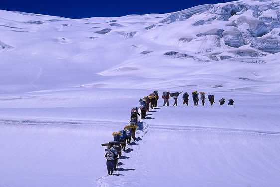 Group of porters approaching Hispar La pass, Karakoram Mountains