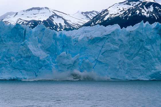 Ice boulder plunging into the lake, Perito Moreno Glacier, Los Glaciares National Park, Argentina