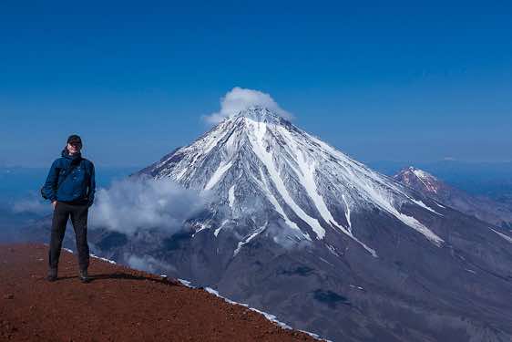 The photograper on top of Avachinsky volcano, 2741m, with Koryaksky volcano, 3456m, seen in the background