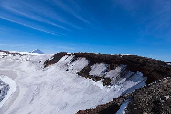 A huge (3 km diameter) circular collapse caldera is located on the summit of Plosky Tolbachik, 3085m