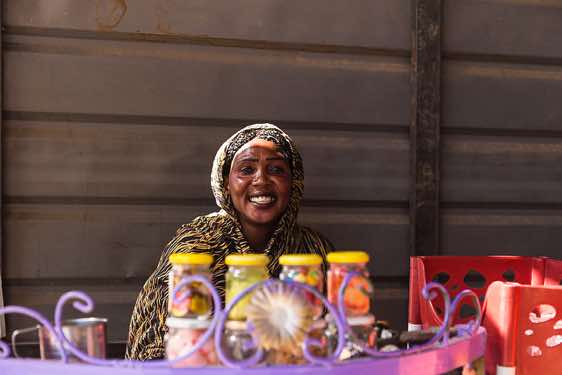 Sudanese woman preparing coffee or tea, Northern Sudan