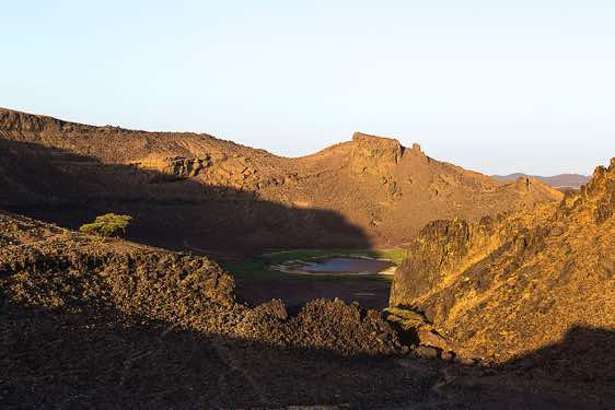 Atrun crater where Bisharin nomads come to collect salt, Bayuda Desert, Atrun, Northern Sudan