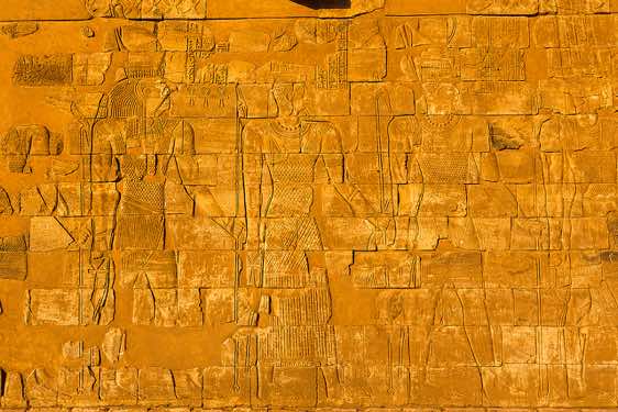 The reliefs on the outer side walls of the Lion temple represent a number of deities, among them the deiti Horus (left), Naqa (Naga), Northern Sudan
