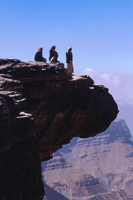 Standing on the edge of a cliff, Yemen mountains