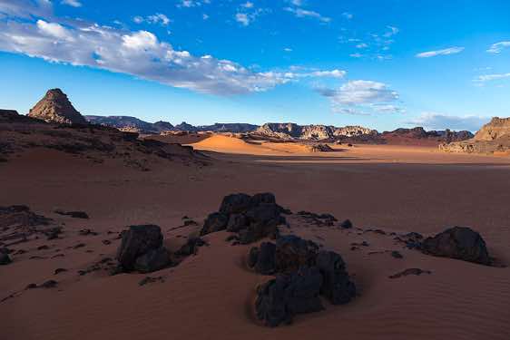 Rocks and sand dunes at the cirque, Tadrart region, Tassili n ́Ajjer National Park, Sahara, North Africa