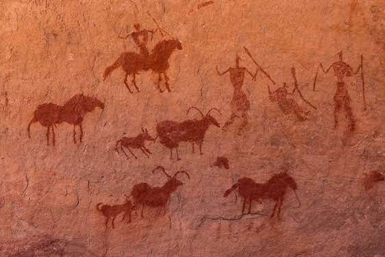 Painted rider on a horse and goats, Neolithic rock art, Tadrart region, Tassili n ́Ajjer National Park, Sahara, North Africa