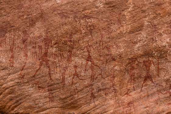 Rock painting of hunters and warriors, Neolithic rock art, Bovidian period, Tadrart region, Tassili n ́Ajjer National Park, Sahara, North Africa