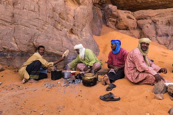 Tuareg baking bread, Tadrart region, Tassili n ́Ajjer National Park, Sahara, North Africa