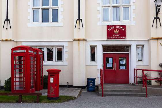 Stanley post office, with British red post and telephone boxes, Falkland Islands