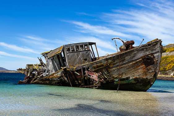 Protector III at the landing site at Coffin’s Harbour in the Falkland Islands was beached at New Island in 1969, slowly decaying in the sand ever since