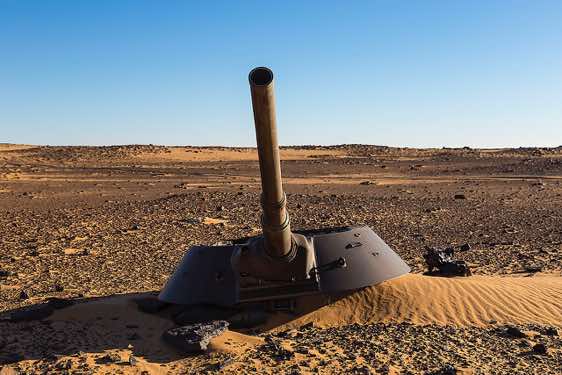 The remnants of a Libyan tank in the desert sand