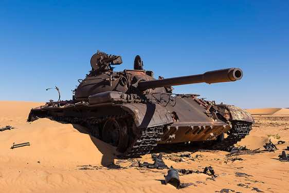 The remnants of a Libyan tank in the desert sand