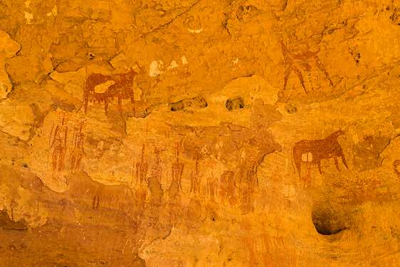 Rock art panel of human figures with large decorated hairstyles and domesticated animals, Terkei West, Ennedi, northeastern Chad