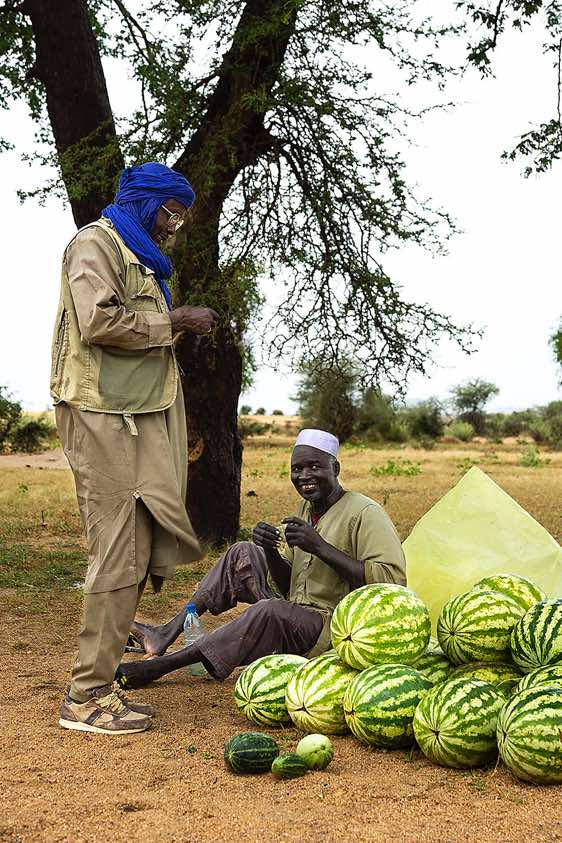 Driver Omar buying a melon