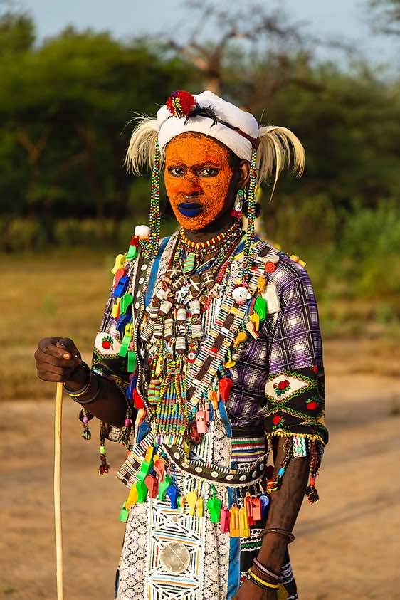 Wodaabe (Bororo) men's outfits at the Gerewol festival are vibrantly decorated, embellished with beads, feathers, buttons or even whistles in the brightest of colours