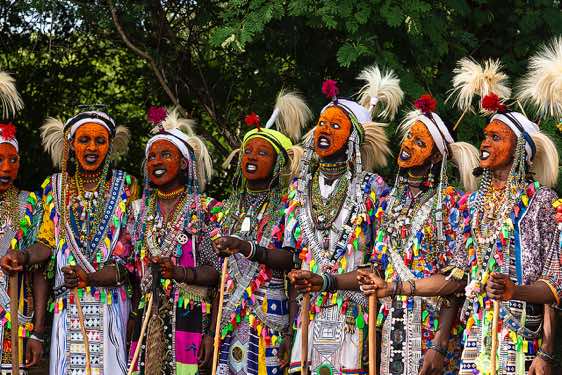 Wodaabe (Bororo) men at the Gerewol festival wearing elaborate makeup and clothing