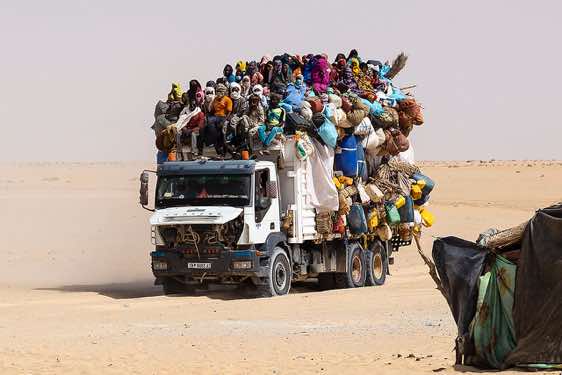 Truck loaded with goods and people in the desert, Borkou region