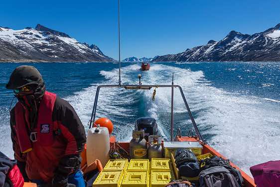 Inuit steering the boat, Ikaasartivaq Strait