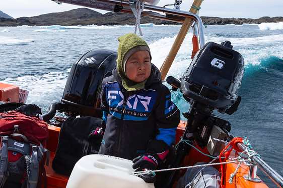 Young Inuit boy, boat transfer from Kulusuk Island to Tasiilaq, Ammassalik Fjord