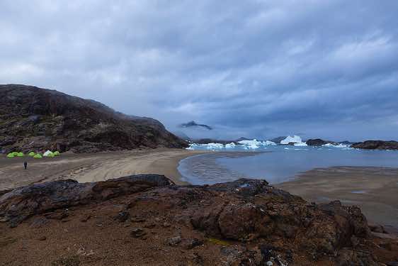Campsite with icebergs in the background near Sermilik Research Station, Sermilik Fjord, Ammassalik Island