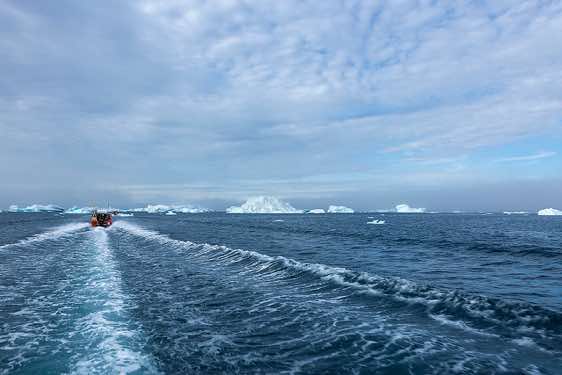 Boats on their way from Tasiilaq to Sermilik Fjord, Ammassalik Island
