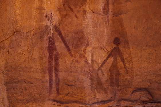 A painting of stylised human figures, Wadi Teshuinat area, Jabal Akakus