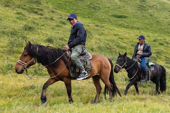 Togoldor and Dashhun on horses, Tavan Bogd National Park, Altai Mountains, Western Mongolia
