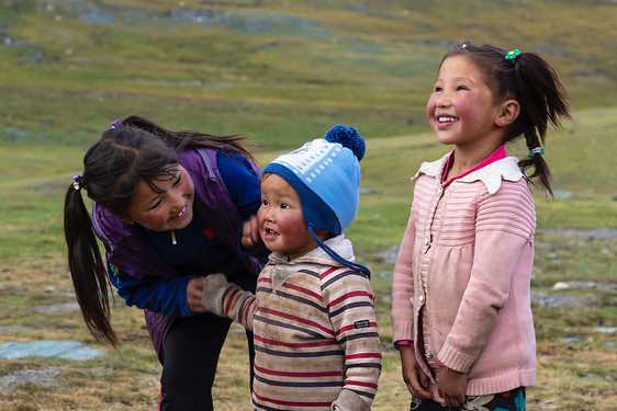 Nomad kids at campsite, Tavan Bogd National Park, Altai Mountains, Western Mongolia