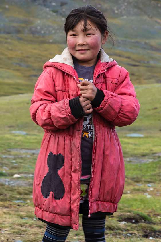 Nomad girl at campsite, Tavan Bogd National Park, Altai Mountains, Western Mongolia