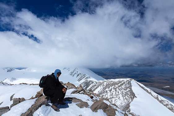 Local guide Daulet on top of Malchin Peak (4050m), Tavan Bogd National Park, Altai Mountains, Western Mongolia
