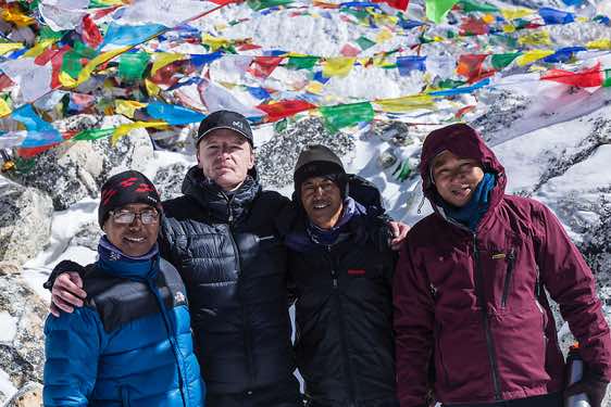 Guide Jangbu Sherpa, the photographer, Kancha Tamang, Tshiring Sherpa on top of Larkya La pass, 5100m