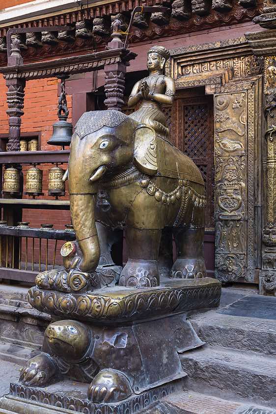 Gilt statue inside the courtyard of the Golden Temple, Patan