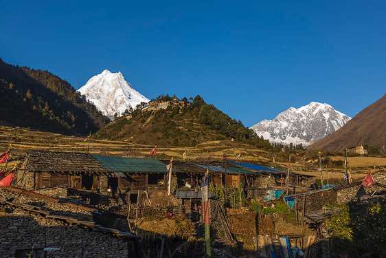 Manaslu, 8163m, Naike Peak, 6211m, and Gompa, seen from Lho village in the Buri Gandaki Valley