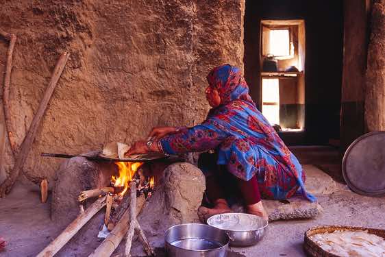 Woman baking bread, Al Hamra