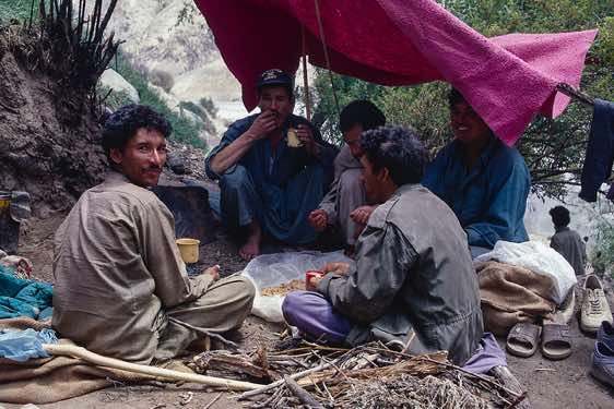 A group of porters is having a meal, Camp Paiju, Karakoram Mountains