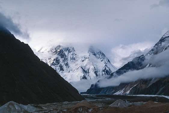 K2 (Chogori), 8611m, in clouds, seen from Concordia, Karakoram Mountains