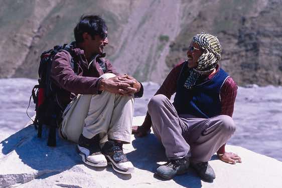 Porter Sirdar Ibrahim and local guide Alif Khan have a chat, Karakoram Mountains
