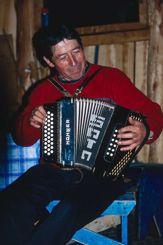 Luis Soto playing accordion, Fundo San Lorenzo, Chile