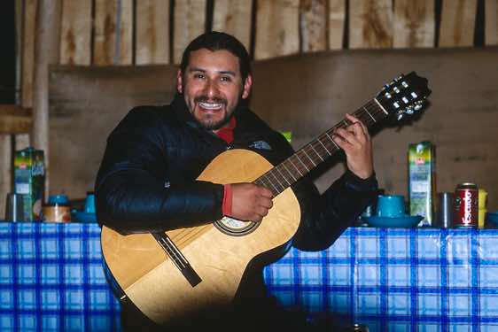 Guide Sergio playing guitar, Fundo San Lorenzo, Chile