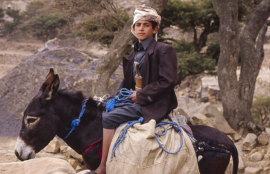 Boy on a donkey with jambiya