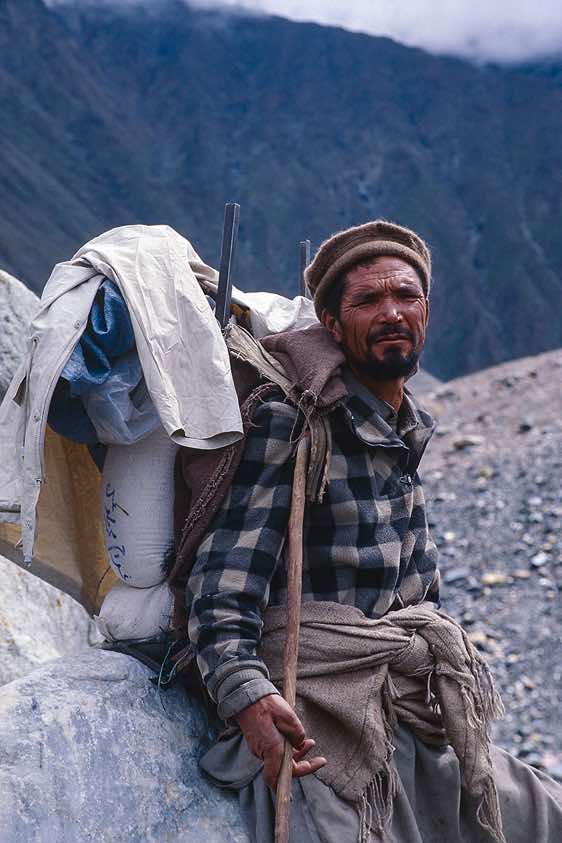 Porter with his heavy payload, Baltoro Glacier, Karakoram Mountains