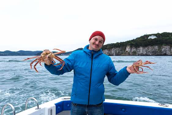 Guide Ivan with giant red crabs, Avacha Bay, Petropavlovsk, Kamchatka