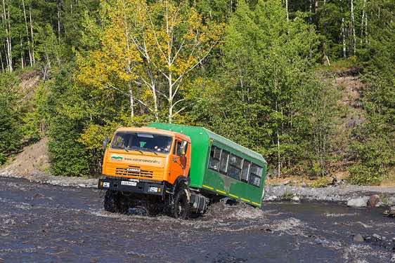 Kamaz crossing a river on route to the Tolbachik volcano, located 570 km north of Petropavlovsk-Kamchatsky