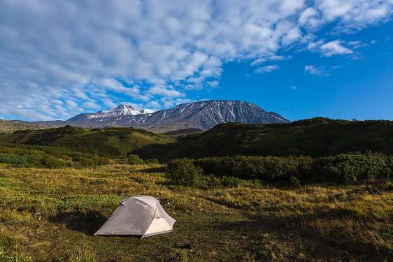 Campsite with Tolbachik volcano in the background, Klyuchevskoy Nature Park