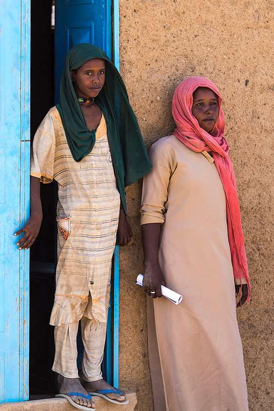 Bisharin nomad girls in front of local school, Bayuda Desert, Northern Sudan